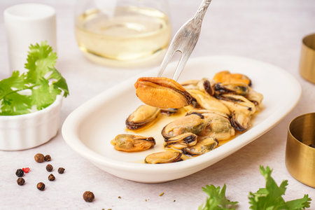 Plate with pickled mussels on white backgroundの写真素材