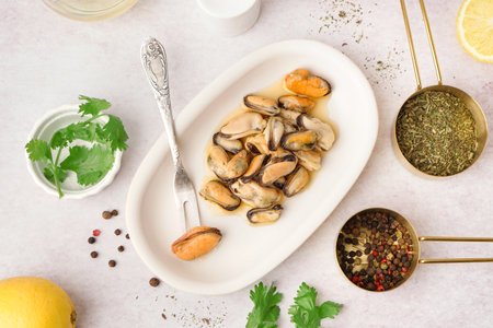 Plate with pickled mussels on white backgroundの写真素材