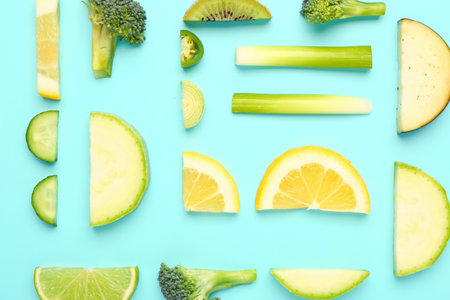 Composition with fresh fruits and vegetables on turquoise backgroundの写真素材