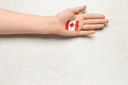 Female hand drawn flag of Canada on white backgroundの写真素材