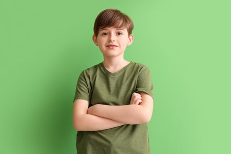 Little boy on green background. Children's Day celebrationの写真素材