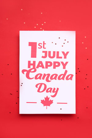 Card with text 1ST JULY HAPPY CANADA DAY and stars on red backgroundの写真素材