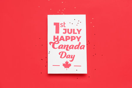 Card with text 1ST JULY HAPPY CANADA DAY and stars on red backgroundの写真素材