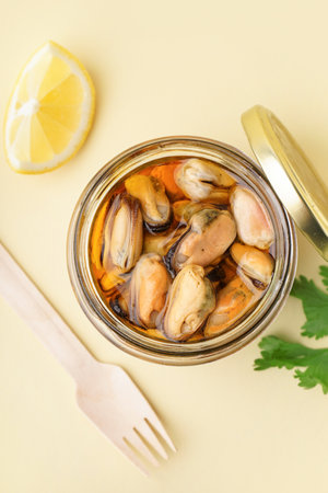 Jar with pickled mussels on gray backgroundの写真素材