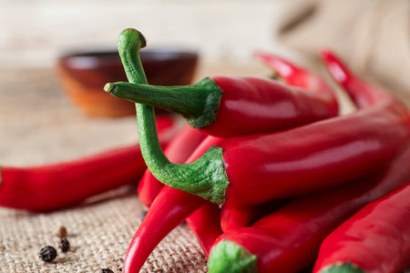 Heap of fresh chili peppers on table, closeupの写真素材