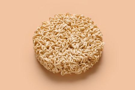 Raw instant noodles on beige backgroundの写真素材