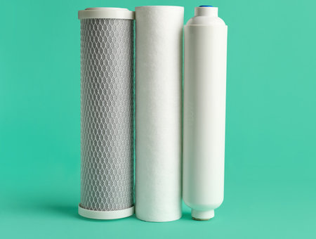 New water filter cartridges on green backgroundの写真素材