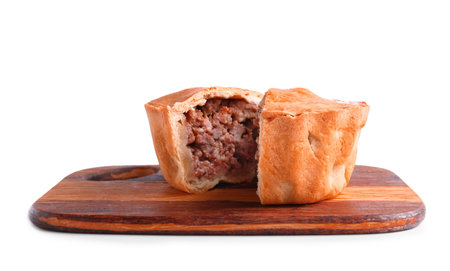 Wooden board with tasty meat pot pie on white backgroundの写真素材