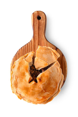 Wooden board with tasty meat pot pie on white backgroundの写真素材