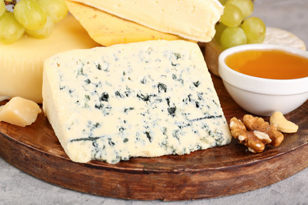 Plate tasty cheese on table, closeupの写真素材