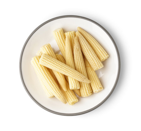 Plate of tasty canned corn cobs on white backgroundの写真素材
