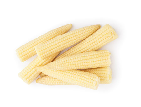 Heap of tasty canned corn cobs on white backgroundの写真素材