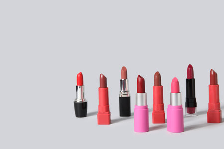 Set of beautiful lipsticks on gray backgroundの写真素材
