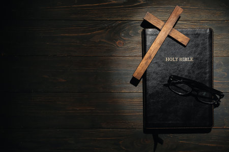 Holy Bible, cross and eyeglasses on wooden backgroundの写真素材