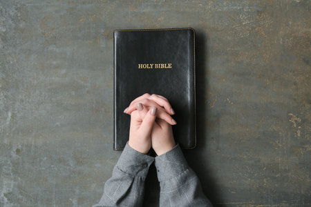 Woman with Holy Bible on grunge backgroundの写真素材