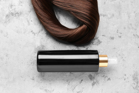 Brown hair spray on grunge background