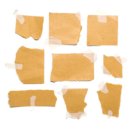 Attached pieces of torn paper sheets isolated on white backgroundの写真素材