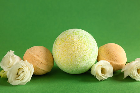 Bath bombs with roses on green backgroundの写真素材