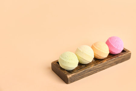 Stand with bath bombs on beige backgroundの写真素材