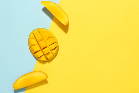 Fresh cut mango on color backgroundの写真素材