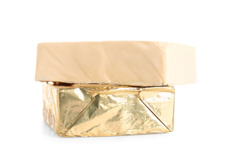 Processed cheese in foil isolated on white backgroundの写真素材