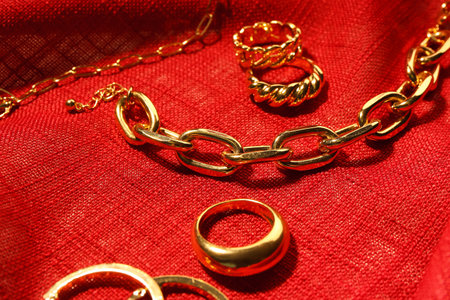 Beautiful jewelery on red fabric backgroundの写真素材