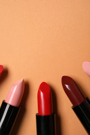 Different lipsticks on beige background, closeupの写真素材