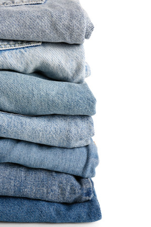 Different folded denim jeans on white backgroundの写真素材