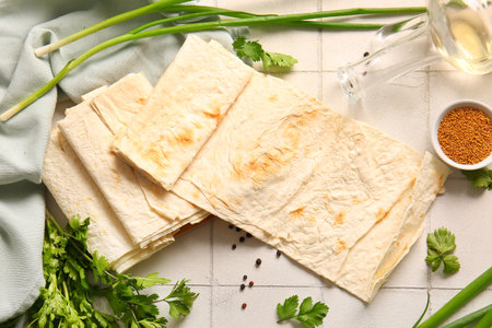 Fresh lavash on white tile backgroundの写真素材