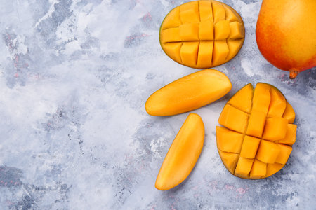 fresh ripe mangoes on grunge backgroundの写真素材