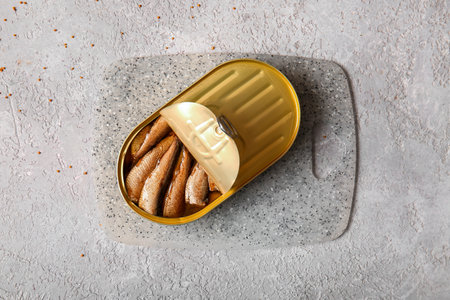 Board of canned smoked sprats on gray backgroundの写真素材