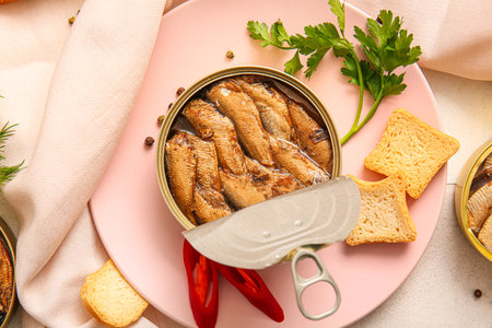 Plate of canned smoked sprats with chilli on tableの写真素材
