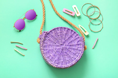 Stylish bag and accessories on turquoise backgroundの写真素材