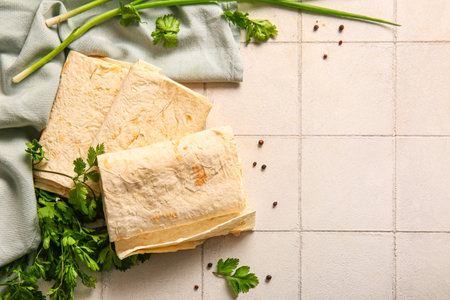 Fresh lavash on white tile backgroundの写真素材