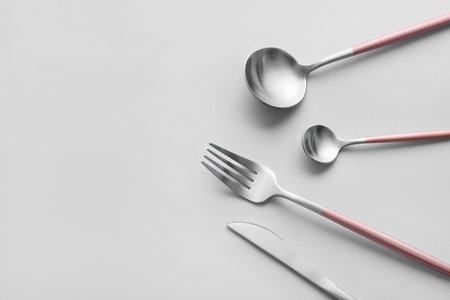 Stylish cutlery on gray backgroundの写真素材
