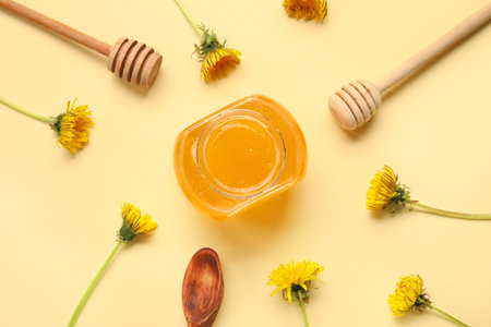 Jar with dandelion honey on beige backgroundの写真素材
