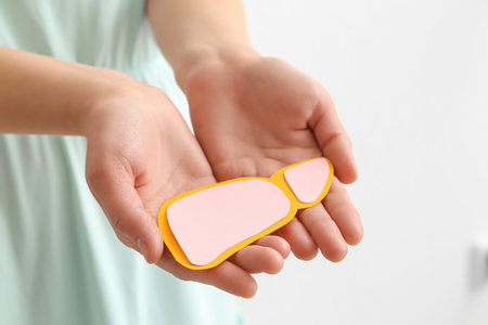 Woman holding pink liver on white background