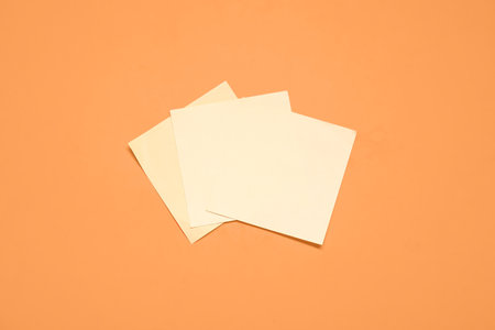Sticky notes on orange backgroundの写真素材