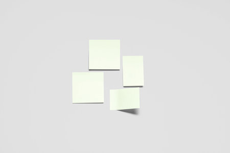 Pale yellow sticky notes on gray backgroundの写真素材