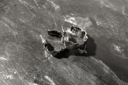 Beautiful earrings on dark backgroundの写真素材