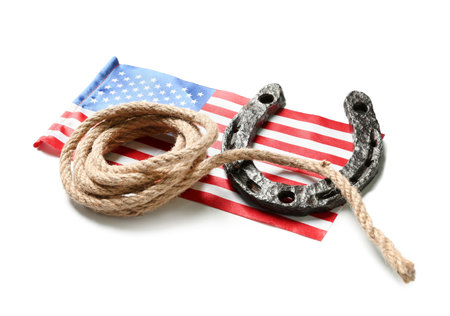 Flag of USA, lasso and horseshoe isolated on white backgroundの写真素材