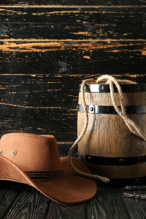 Cowboy hat, lasso and horseshoe on wooden backgroundの写真素材