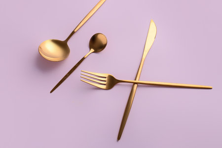 Stylish cutlery on pink backgroundの写真素材