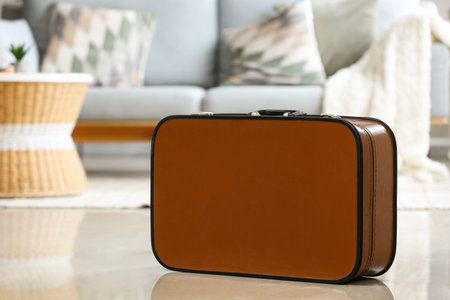 Brown suitcase in living room