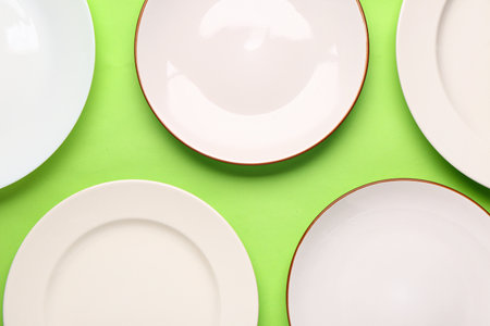 Composition with clean plates on green backgroundの写真素材