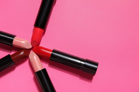 Different lipsticks on pink background, closeupの写真素材