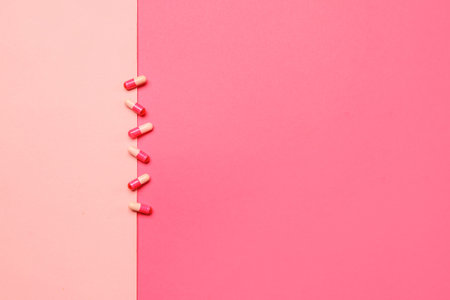 Hormonal pills on color background