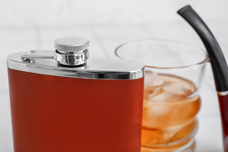 New hip flask on light table, closeupの写真素材