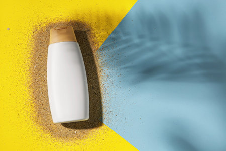 Bottle of sunscreen cream on color backgroundの写真素材