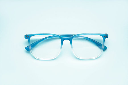 New gradient eyeglasses on pale blue backgroundの写真素材